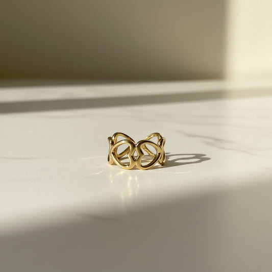 Anillo Acero Abierto Corazones Calados Dorado